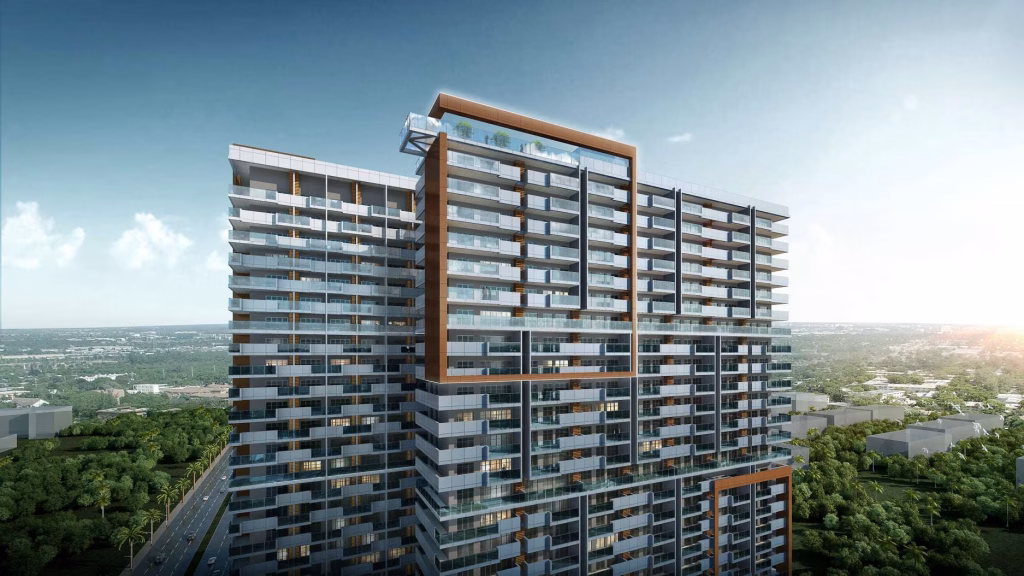 A modern high-rise apartment building with glass balconies and geometric architectural details, this property offers a Studio Unit For Sale, nestled among greenery with a distant cityscape under a clear sky.