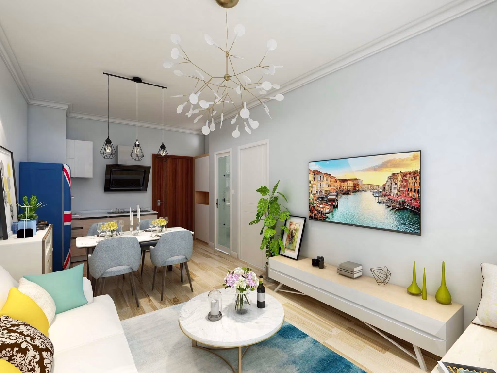 Modern living room with light-colored walls, a white sofa, marble coffee table, and TV displaying a canal scene—perfect for relaxing in this Sihanoukville Studio For Sale. Decorative plants, chandelier, and dining area with blue chairs complete the space.